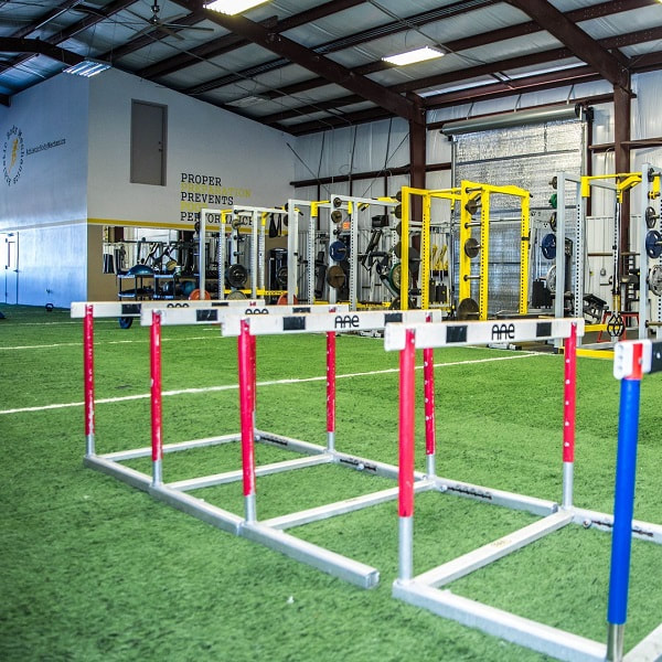 Athletic Body Mechanics facility showing hurdles